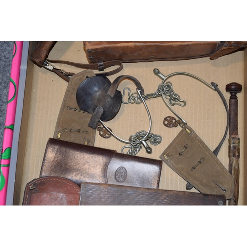 309 - Mixed collection of military items to include cavalry spurs, saddle bags, leather gun holster, epaul... 