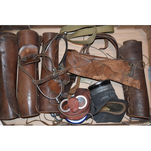 310 - Mixed collection of mitiray items to include cavalry spurs, gas masks, belts and various other simil... 