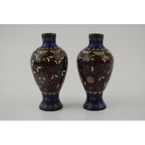 334 - A small pair of cloisonné high shouldered vases, decorated with butterflies and flowers, 9.5cm tall.