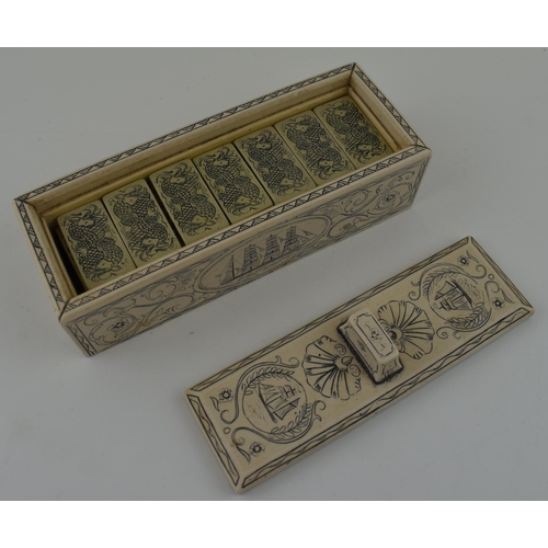 335 - A set of dominoes in case with scrimshaw style decoration. 17cm.