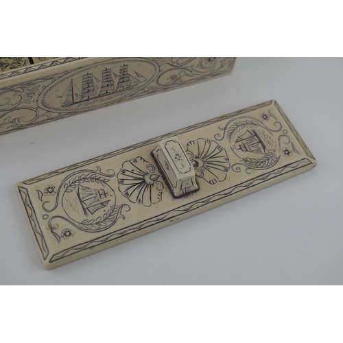 335 - A set of dominoes in case with scrimshaw style decoration. 17cm.