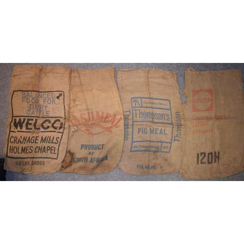 347 - A collection of vintage agriculural hessian sacks with 'Fish Meal', 'Pig Meal', Dairy Meal' and simi... 