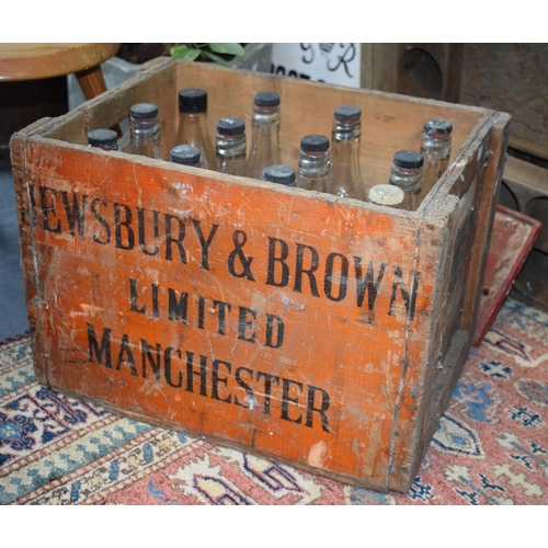 349 - A vintage bottle crate for 'Jewsbury & Brown' Limited Manchester with a selection of 12 vintage bott... 