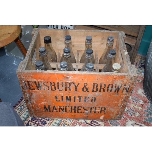 349 - A vintage bottle crate for 'Jewsbury & Brown' Limited Manchester with a selection of 12 vintage bott... 