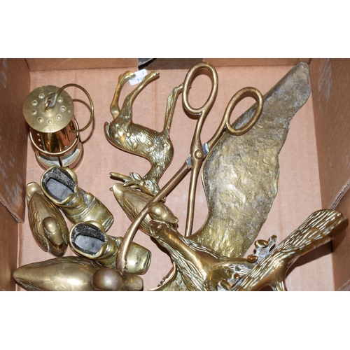 357 - Metalware to include a large brass eagle, a miniature miners, ducks, boot match strikers and others ... 