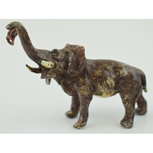 365 - A reproduction painted cast metal figure of an elephant, in the style of Bergman, 8cm long.