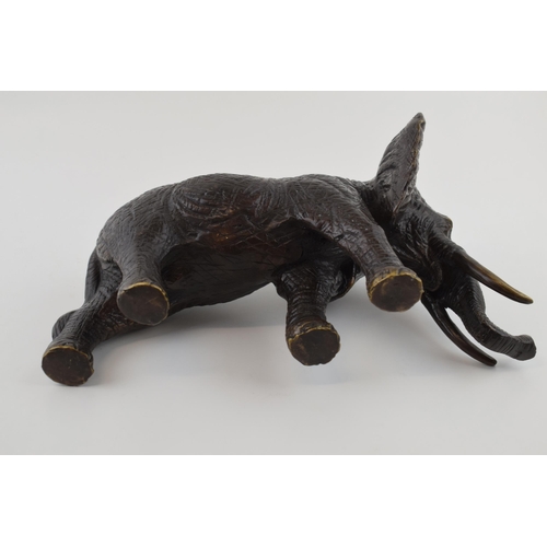 366 - Large contemporary bronzed figure of a walking elephant, with two tusks, 30cm long.