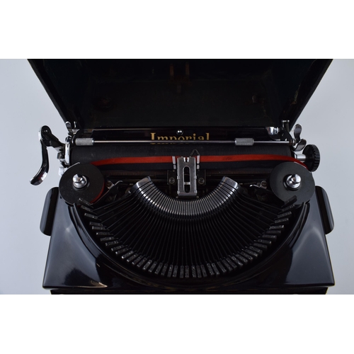 372 - An 'Imperial' portable typewriter 'The Good Companion' in original case. Made in Leicester. 29cm x 3... 