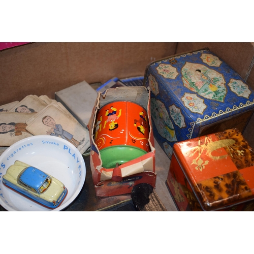 376 - A mixed collection of vintage items to include tin plate toys, advertising tins, cards, an antique p... 