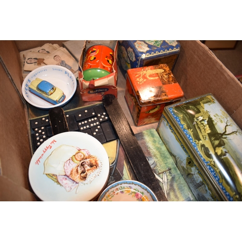 376 - A mixed collection of vintage items to include tin plate toys, advertising tins, cards, an antique p... 