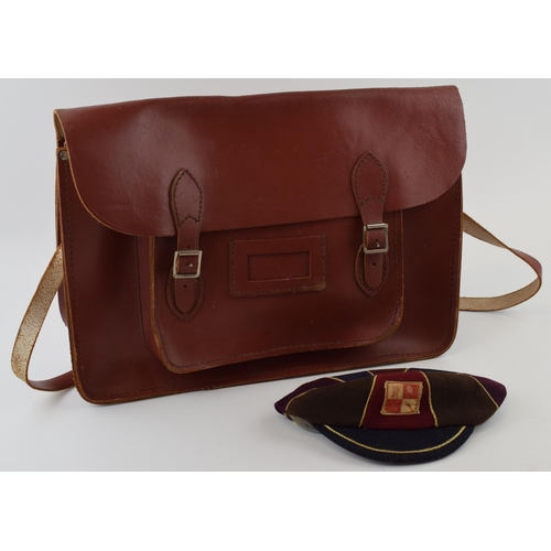 378 - A vintage leather school satchel together with a school cap. (2)