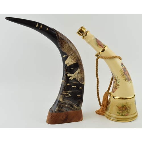 379 - Spirit of Robin Hoode pottery decanter in the form of a horn, with a carved horn with eagle design (... 