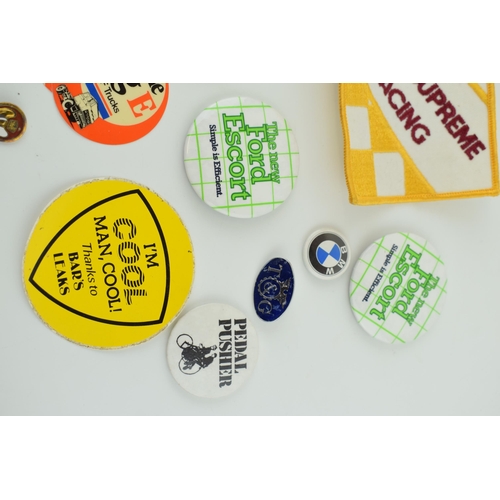 390 - A collection of vintage badges and patches relating to motoring, BMW, Ford Escort, and DAF trucks. c... 