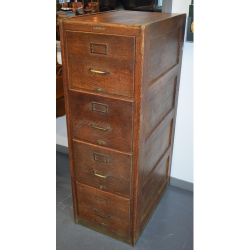 426 - Oak Four drawer filing cabinet by 'Shaw Walker' London. Brass handles. 133cm x 70cm x 45cm.