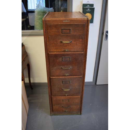 426 - Oak Four drawer filing cabinet by 'Shaw Walker' London. Brass handles. 133cm x 70cm x 45cm.