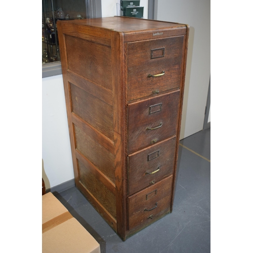 426 - Oak Four drawer filing cabinet by 'Shaw Walker' London. Brass handles. 133cm x 70cm x 45cm.