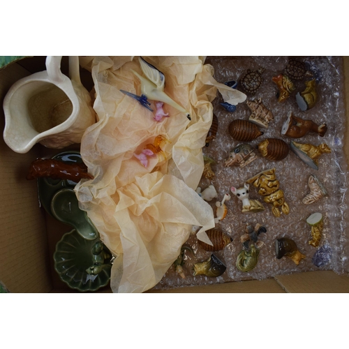 673 - A collection of ceramic items to include Wade Whimseys, miniature glass items, together with other W... 