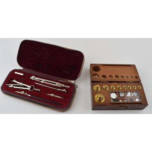 434 - A mahogany cased set of scientific weights made in Rotterdam together with a set of compasses made i... 