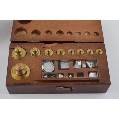 434 - A mahogany cased set of scientific weights made in Rotterdam together with a set of compasses made i... 