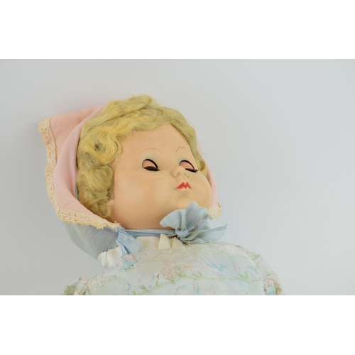 453 - Vintage doll, Made in England c1950s. Moving eyes and period clothing, with a trio of vintage terrac... 