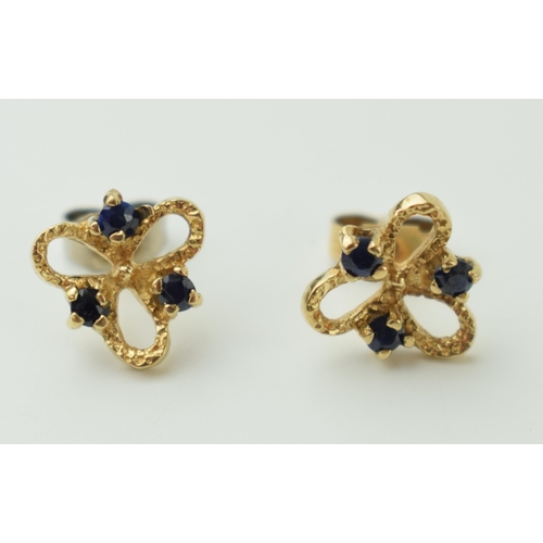 532 - 9ct gold pair of earrings, set sapphires, 1.4g, with a later white metal back.