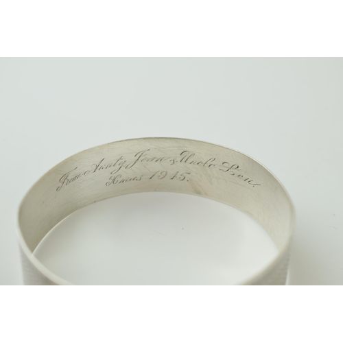 540 - Sterling silver buckle bangle, engineered design, engraving to inner, 29.2g, London 1945.