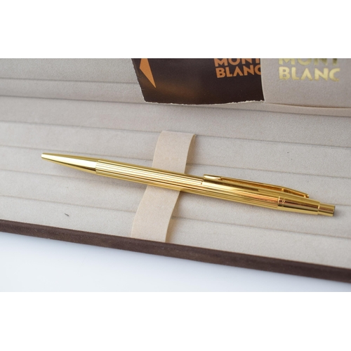 543 - Montblanc Gold Tone Ballpoint Pen, in excellent condition, in original box, guarantee, writing.