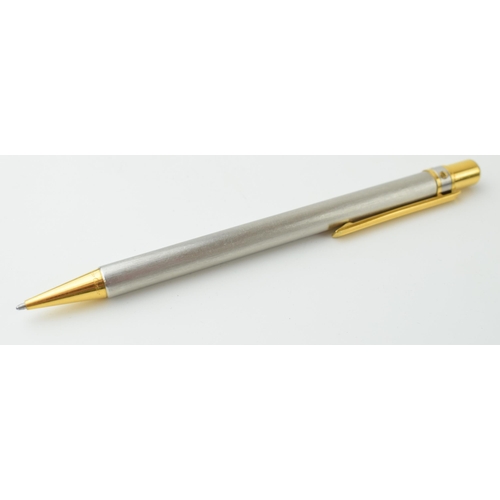 544 - Must de Cartier Ballpoint-Pen, with brushed finish and gilt-metal highlights, serial number C19889, ... 