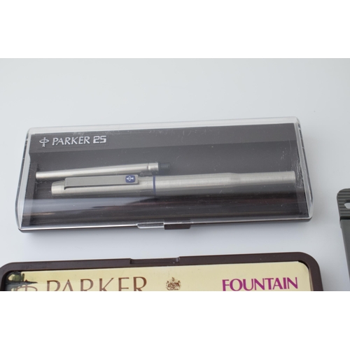 545 - A collection of fountain pens to include two boxed 'Parker 25' pens, Made in England, together with ... 