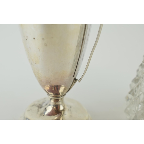 554 - A silver two handled cup, hallmarked Sheffield. Weight (186.6 grams), together with a silver topped ... 