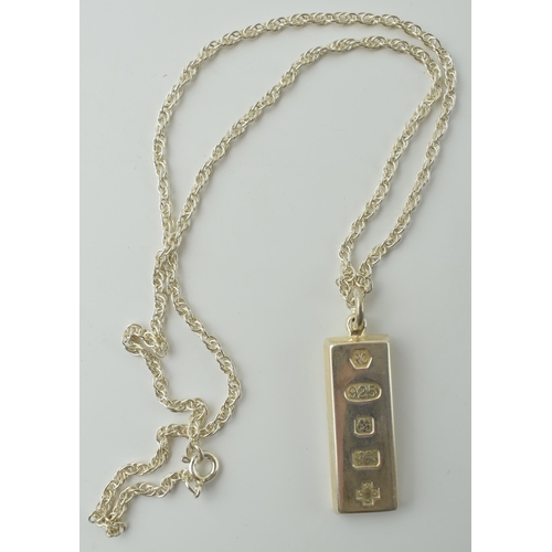 556 - A silver ingot on a necklace. Weight 21.8 grams.