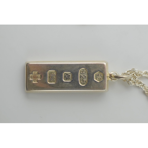 556 - A silver ingot on a necklace. Weight 21.8 grams.