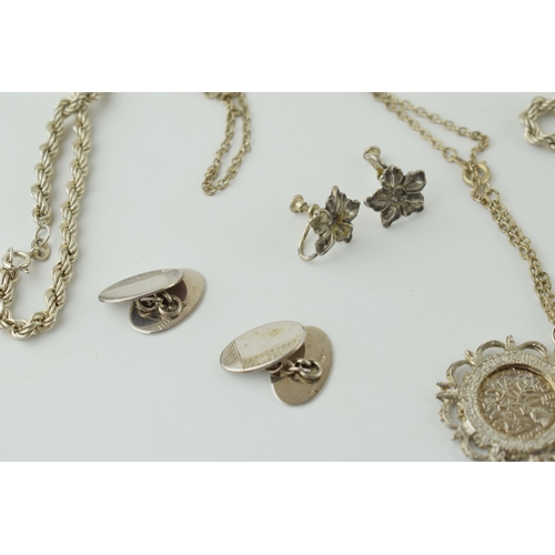 558 - A collection of silver jewellery to include a rope chain, a pair of cufflinks and a pair of clip on ... 