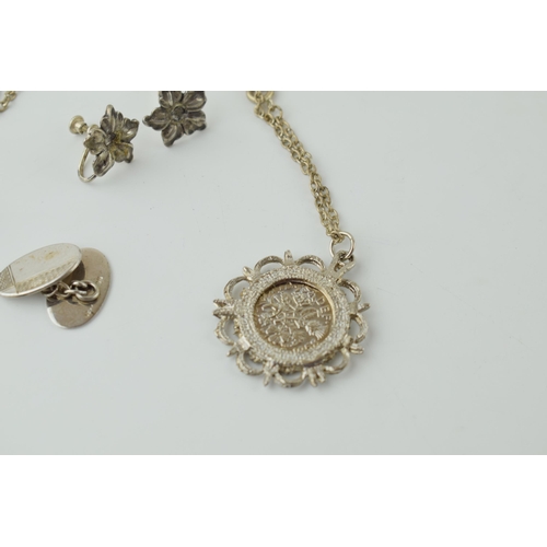 558 - A collection of silver jewellery to include a rope chain, a pair of cufflinks and a pair of clip on ... 