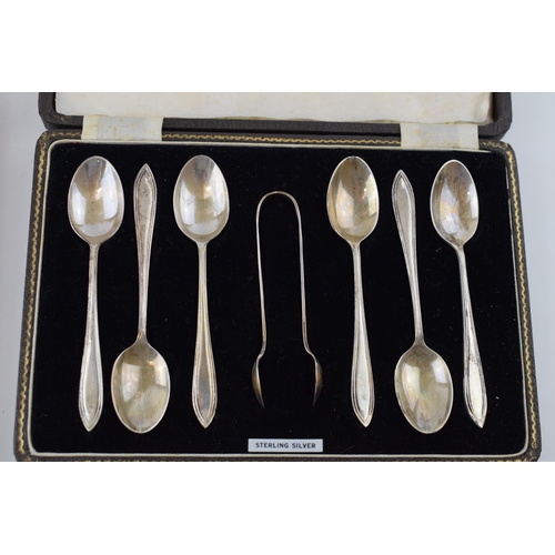 562 - A set of silver spoons hallmarked Birmingham together with a set of set of silver handled knives. (w... 