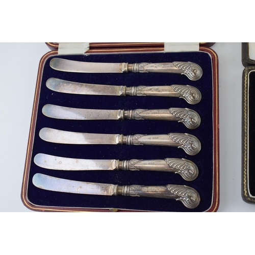 562 - A set of silver spoons hallmarked Birmingham together with a set of set of silver handled knives. (w... 