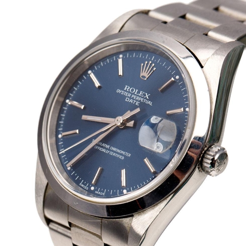 A Rolex Oyster Perpetual Date gentleman's wristwatch. Blue circular dial  with applied baton markers. Date window at 3 o'clock. Smooth bezel with Rolex crown. Original Oyster bracelet. Inner and outer box, papers and guarantee card and all paperwork including swing tag. Case diameter 31mm.