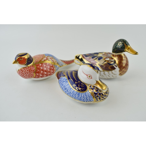 149 - Three Royal Crown Derby paperweights, Mallard, 15cm long, gold stopper and red Royal Crown Derby sta... 