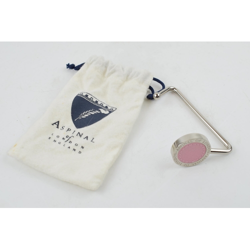 80 - Aspinal of London handbag hook. Chrome plated with pink leather insert Aspinal of London name to top... 