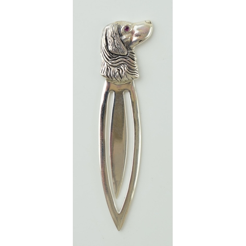 105 - Contemporary silver bookmark with a dogs head finial, 5cm long.