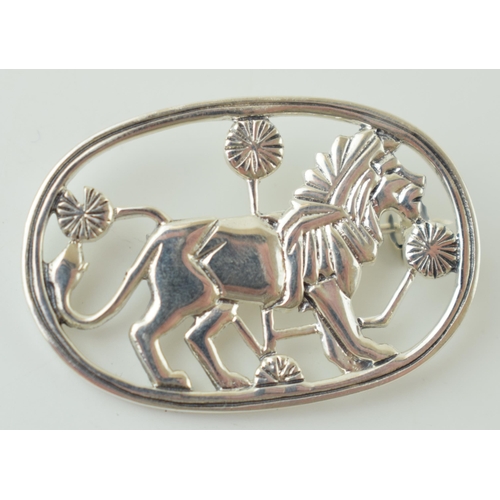 107 - Sterling silver brooch in the form of a stylized lion, Jensen style, 37mm wide.