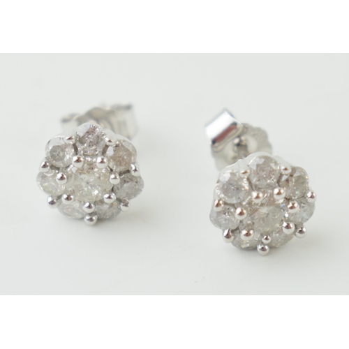 11 - 9ct white gold diamond earrings, flowers head form,  circa combined 0.25ct of diamond, 1.8g (2).