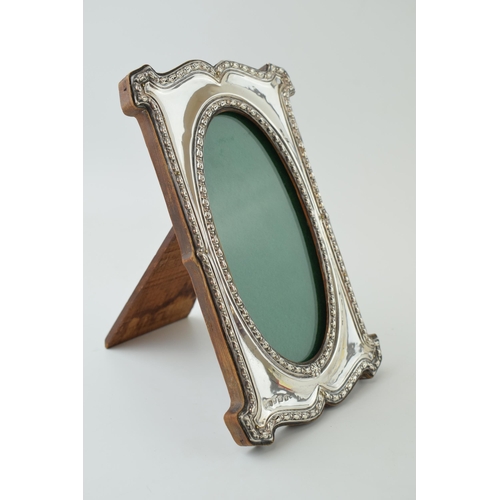 110 - Art Nouveau silver rectangular photo frame, easel back, ornate border, Birmingham 1906, 17.5cm tall.