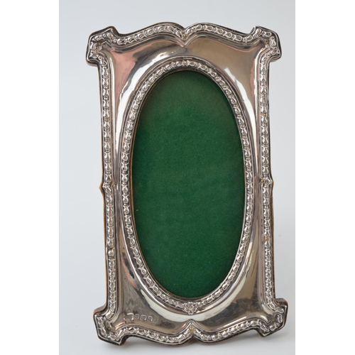 110 - Art Nouveau silver rectangular photo frame, easel back, ornate border, Birmingham 1906, 17.5cm tall.