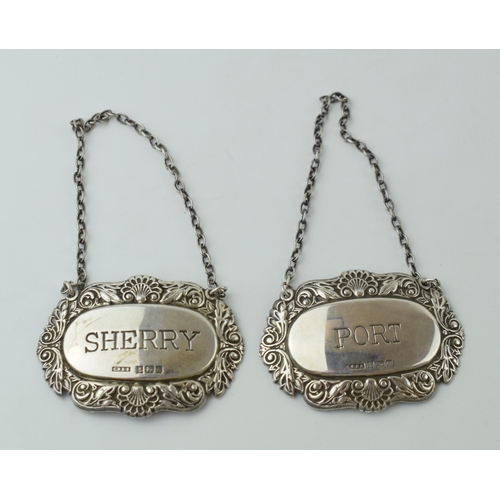 113 - A pair of silver decanter labels to include Port, Birmingham 1990, and Sherry, Birmingham 1979, 23.7... 