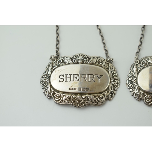 113 - A pair of silver decanter labels to include Port, Birmingham 1990, and Sherry, Birmingham 1979, 23.7... 