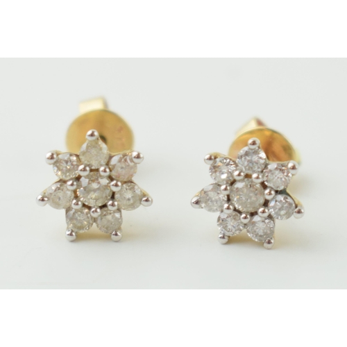 12 - 9ct gold diamond earrings, flowers head form, circa 0.1ct of diamond combined (2), 1.2g.