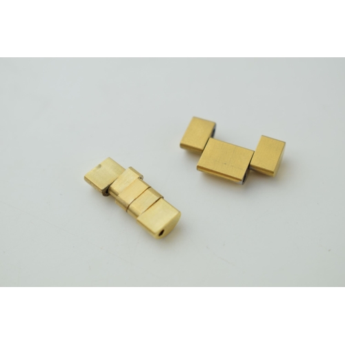 123 - A pair of Rolex or similar gold plated spare links(2).