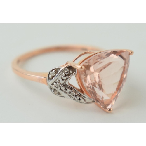 18 - 9ct rose gold ring, set diamonds in shoulder, central semi-precious, 3.1g, size O.