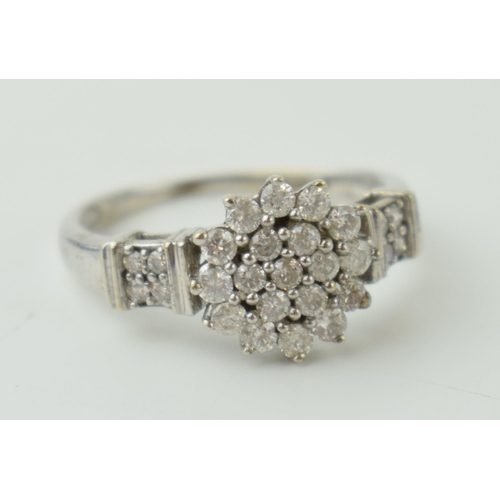 22 - 9ct white gold ring set with diamonds, floral style, 2.3g, size M.